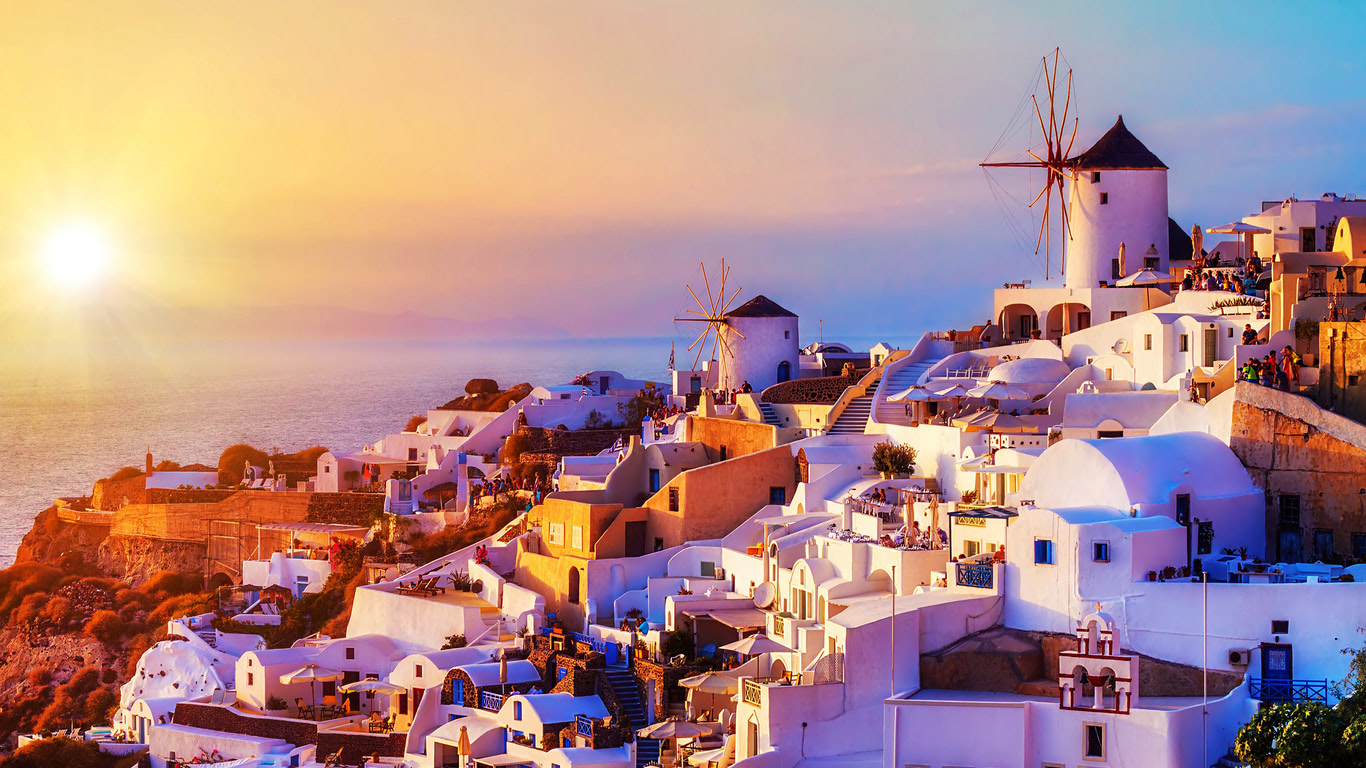 The Spectacular Sunset Over The Oia Village In Santorini Greece