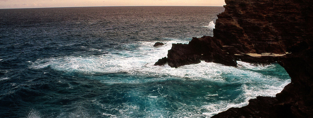 Beach wallpaper of heavy sea and big rocks