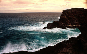 Beach wallpaper of heavy sea and big rocks