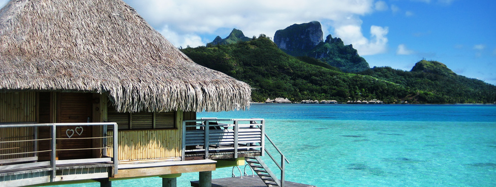 Bora Bora bungalow resort on the beach wallpaper