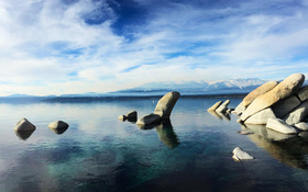 Clear, cobalt blue lake in the snowy Sierra Nevada