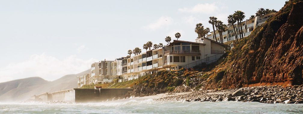 Houses by the beach, surrounded by palm trees at Malibu