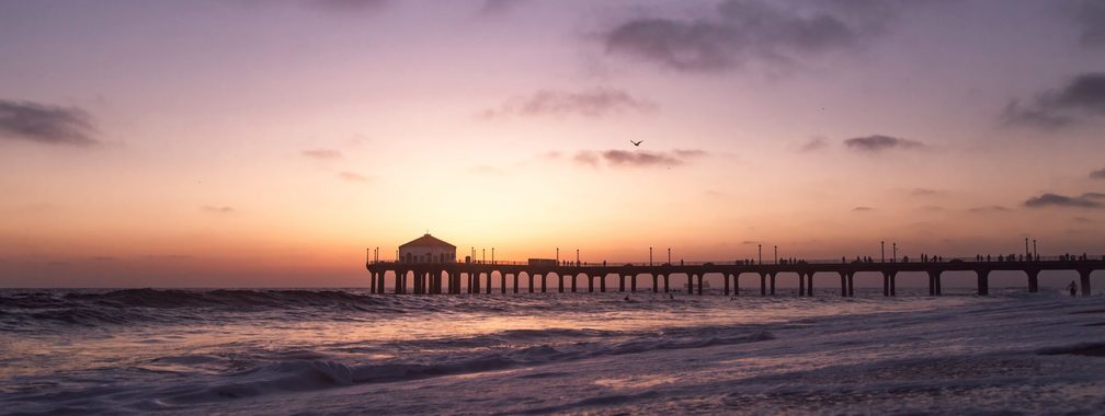 Magical sunset and beautiful waves on Manhattan Beach in California
