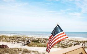 Patriotic flag beside the Atlantic coast in Jacksonville Florida