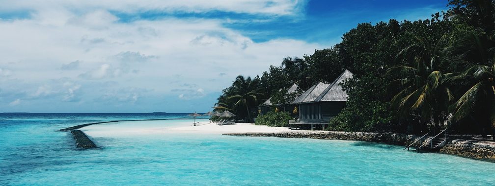 Pristine island and white sandy beach in Gangehi, Maldives