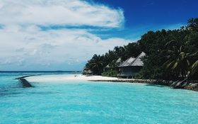 Pristine island and white sandy beach in Gangehi, Maldives