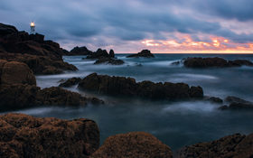 Rocks covered with mist around Corbière Lighthouse, Jersey