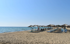 Sandy shore and clear waters at Nea Flogita beach wallpaper
