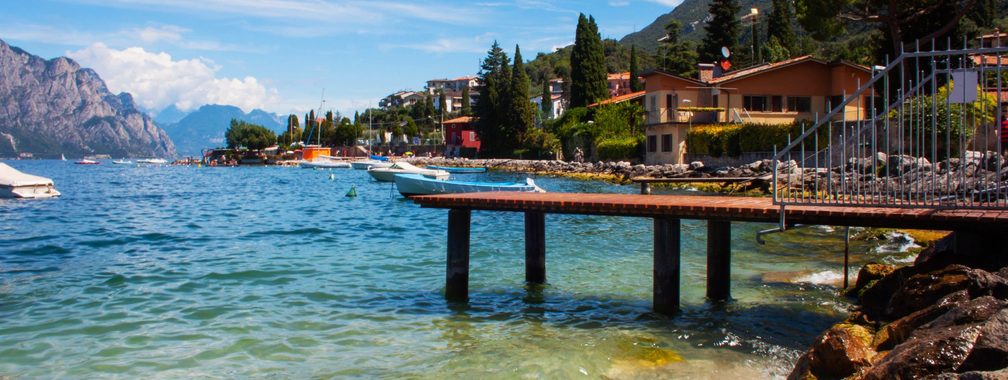 Small town Torbole on lake Garda with blue sky in Italy