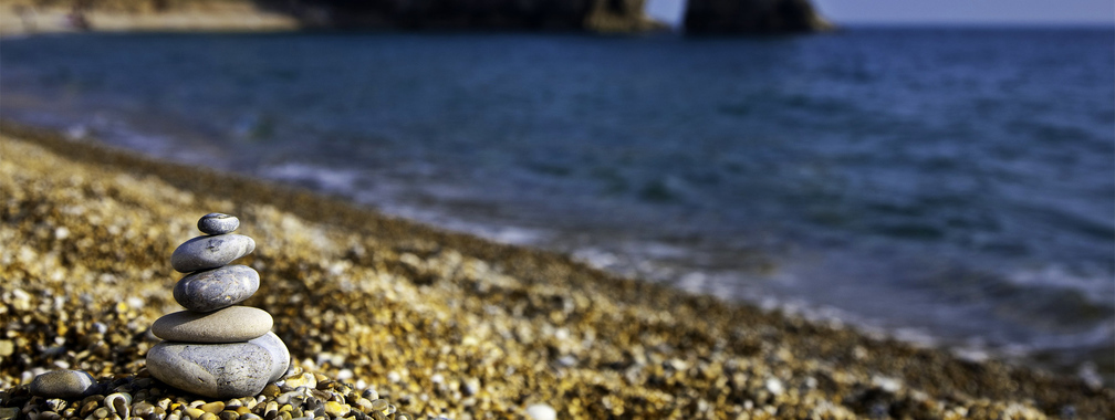 Stones on the sunny beach wallpaper