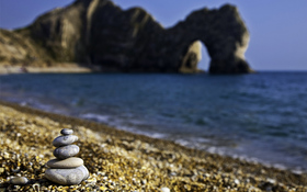 Stones on the sunny beach wallpaper