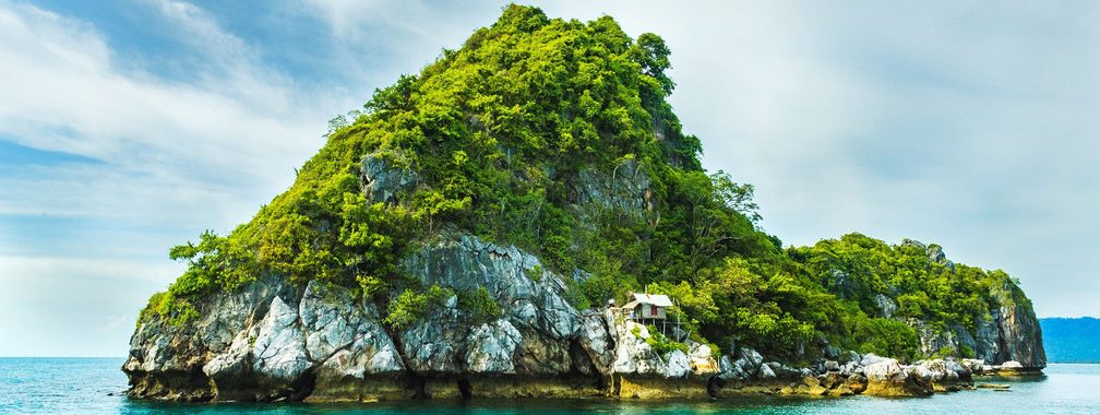 Sunny view on the Gulf of Thailand with exotic house on the rocks
