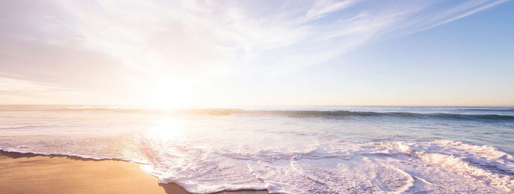 Sunrise above a sandy beach in San Diego, United States