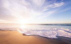 Sunrise above a sandy beach in San Diego, United States