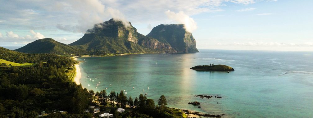 The sun sets over Mt Lidgbird and Mt Gower at Lord Howe Island