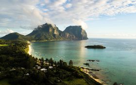 The sun sets over Mt Lidgbird and Mt Gower at Lord Howe Island