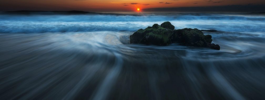 The sunset on a sandy beach in Cape Cod, United States