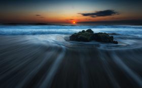 The sunset on a sandy beach in Cape Cod, United States