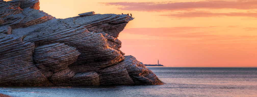 Tranquil sunset over the cliffs of eastern Quebec in Cap Bon Ami, Canada