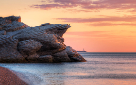 Tranquil sunset over the cliffs of eastern Quebec in Cap Bon Ami, Canada