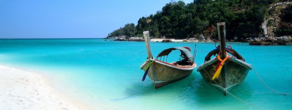 Two boats on the beach of the Ko Lipe island wallpaper