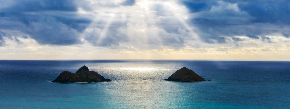 Water sky clouds at Lanikai Beach overlooking the Twin Makulua Islands