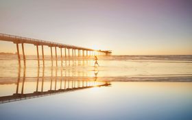 Woman walking on a beach in San Diego, United States