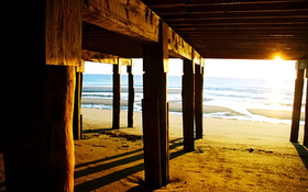 Wooden bridge on the beach background